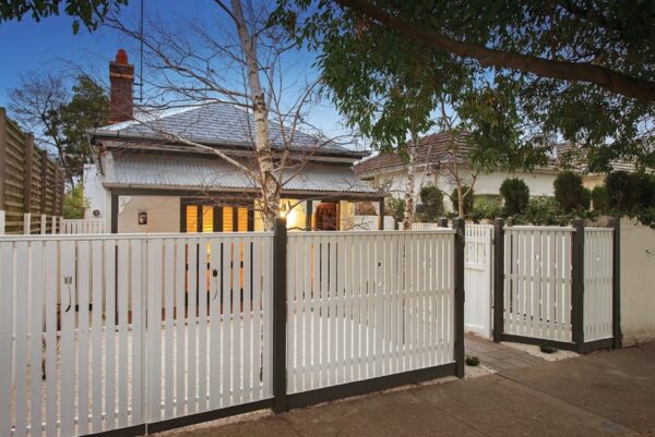 High end home renovation, front of home with picket fence
