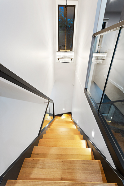 Strathmore Heights custom build looking down staircase with chandelier